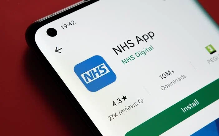 The NHS App listing in the Google Play store on a phone