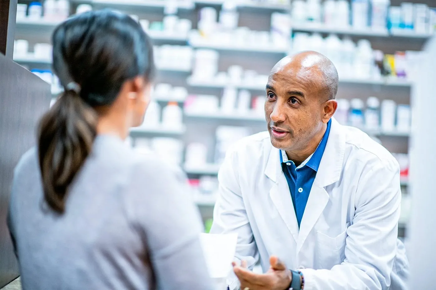 Pharmacist consulting with a patient